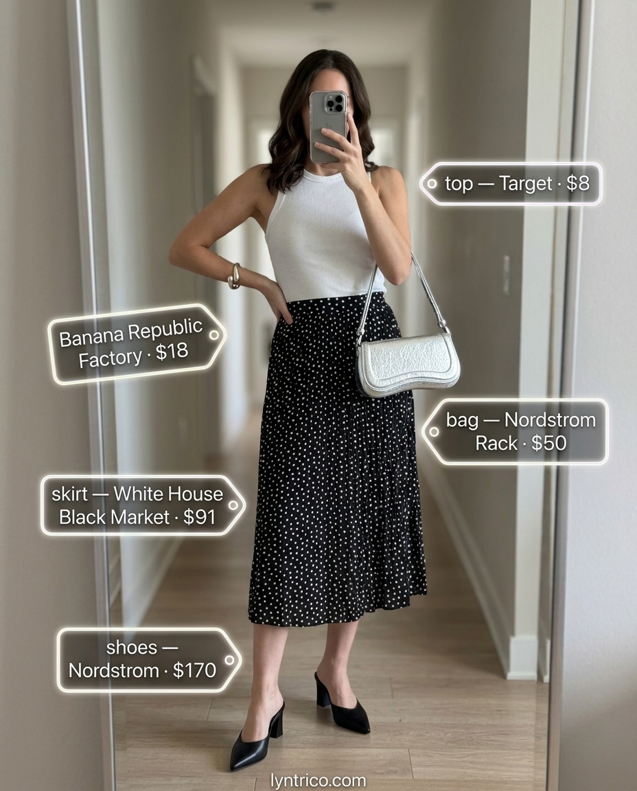 Chic minimalist summer outfits for women 2026: White tank and black pleated midi skirt with silver accessories for a dinner date.