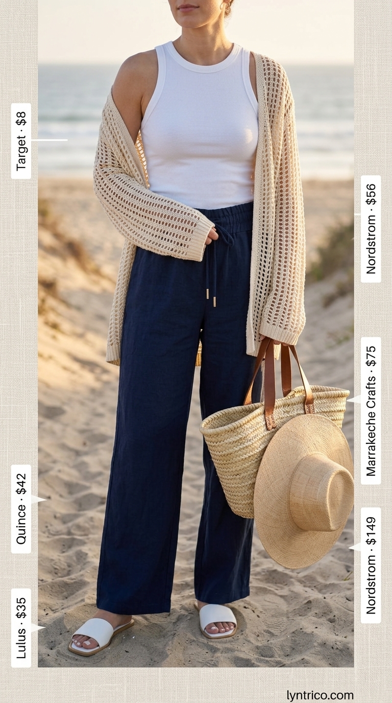 Comfy Oversized Summer Outfits for Women 2026: Resort Vacation Comfy oversized summer outfits for women 2026: Navy linen pants, white tank, open-knit cardigan for relaxed resort. Serene and comfortable.