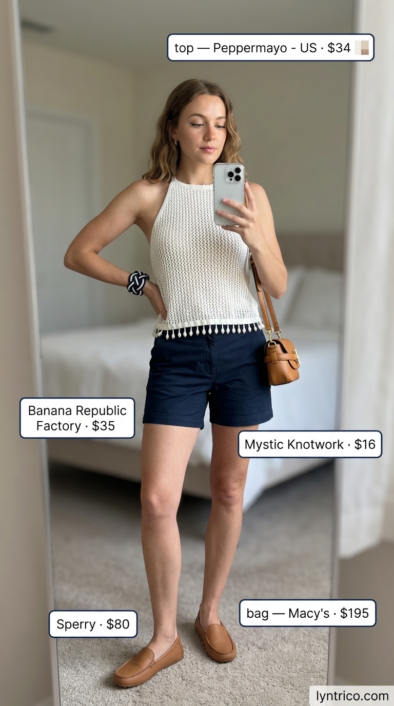 White crochet halter top outfit with navy chino shorts for summer luncheon. Crochet summer halter top outfits 2026.