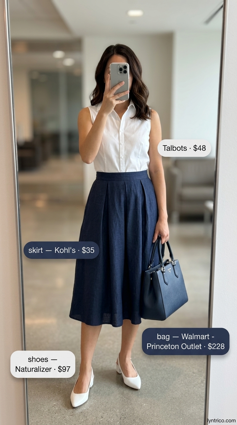 Navy & White Summer Office Skirt 2026 Navy blue A-line midi skirt and white button-down shirt for light summer work outfits for women 2026, with white heels.