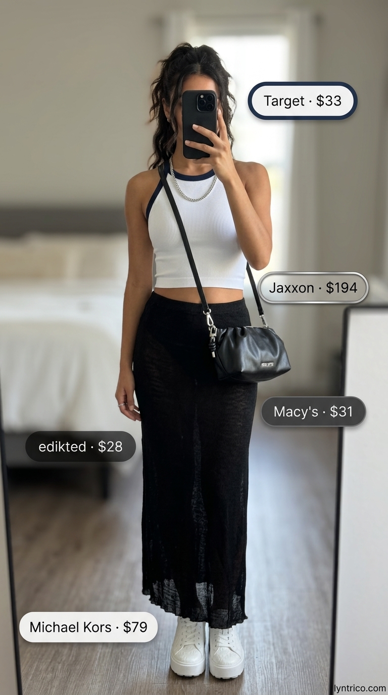 Black jersey maxi skirt with white athletic crop top and platform sneakers for summer 2026.