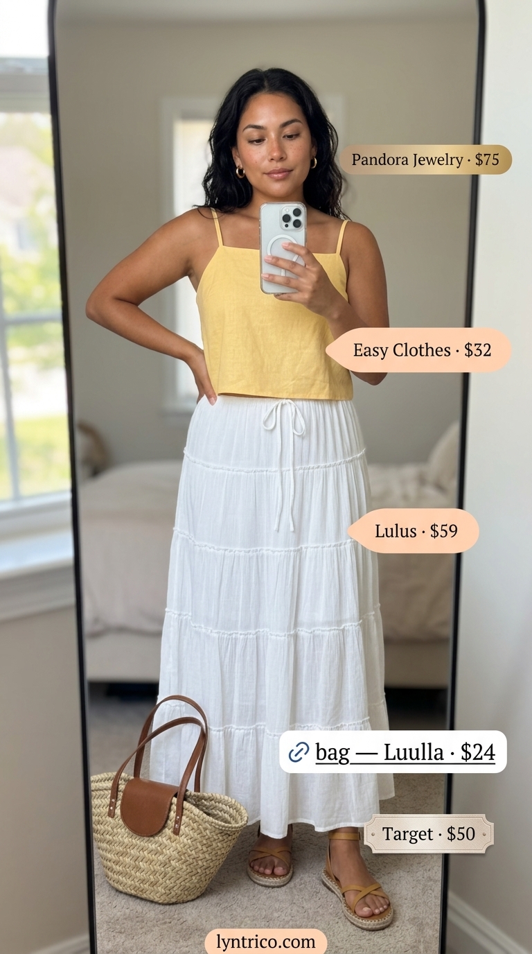 Bright yellow linen crop top with white tiered maxi skirt, ideal for summer 2026 beach vacations.