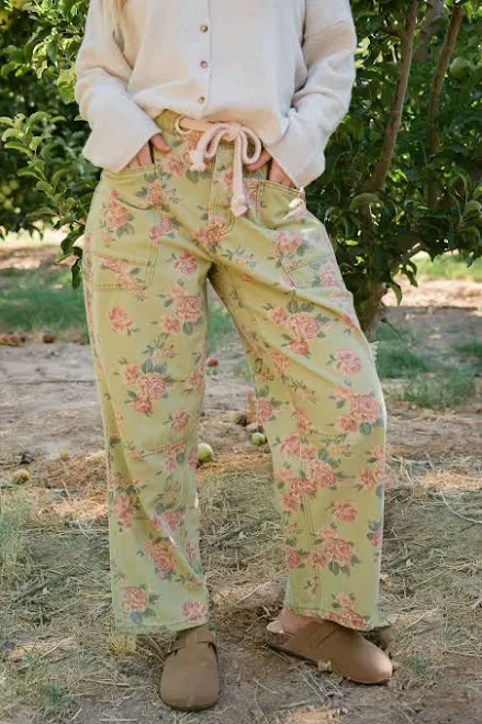 pants THE CHARLI FLORAL PRINT PANTS IN OLIVE X-Large Pink Desert $34.98