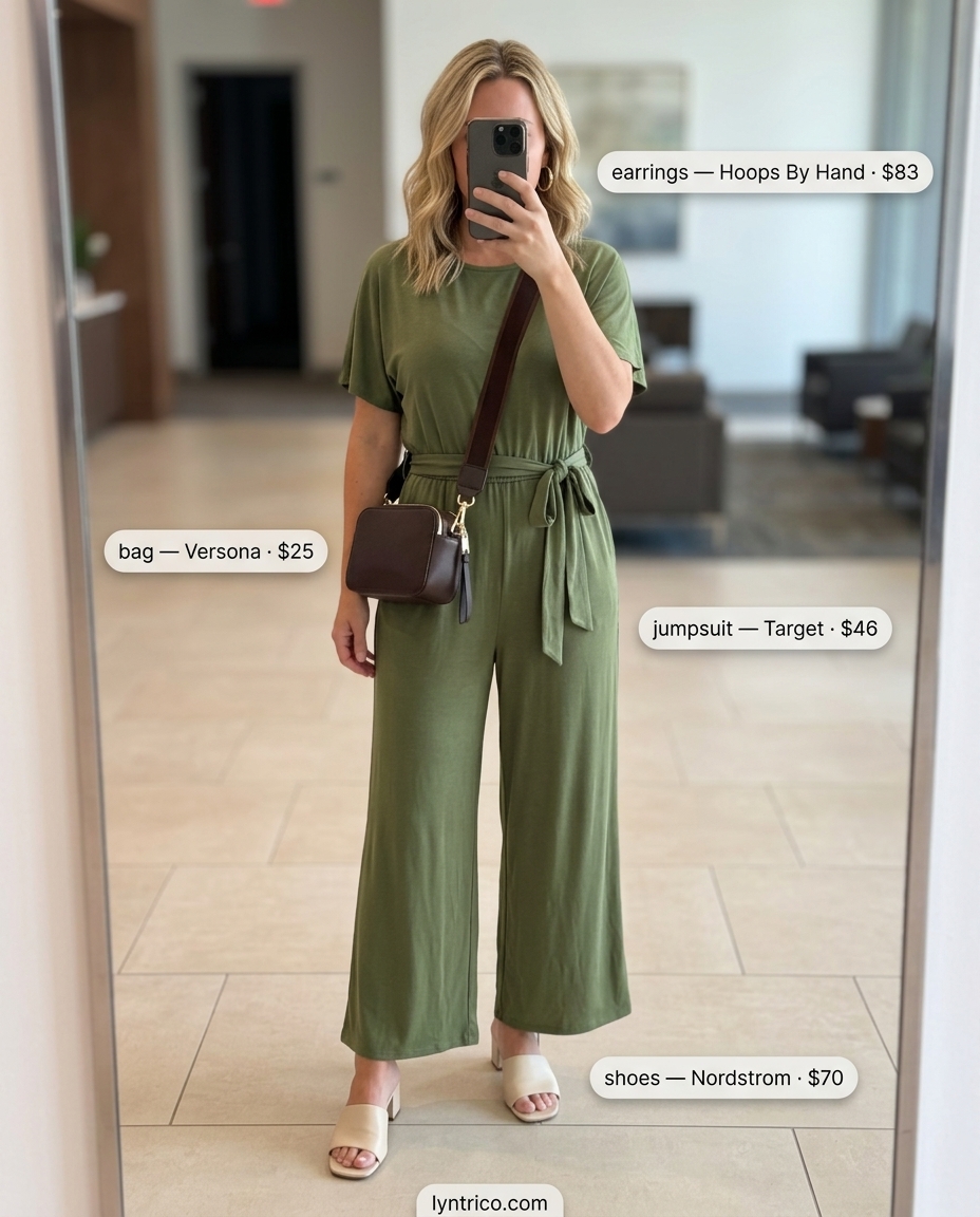 Professional summer office outfits for women 2026: Olive green wide-leg jumpsuit, cream sandals, black bag, gold earrings.