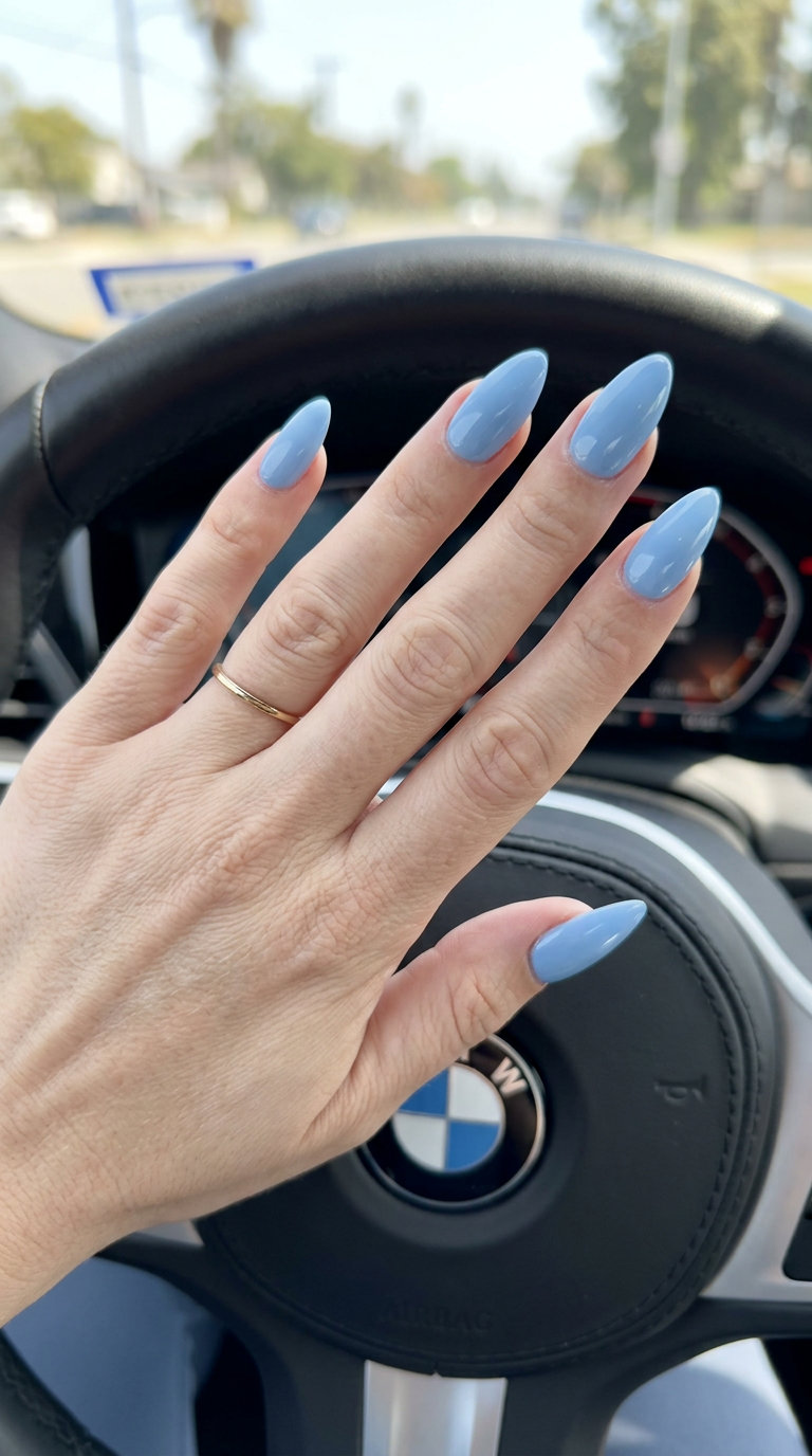 Light Blue Glossy Soft Coffin nails for vacation, a serene and sophisticated look with a sky blue undertone.