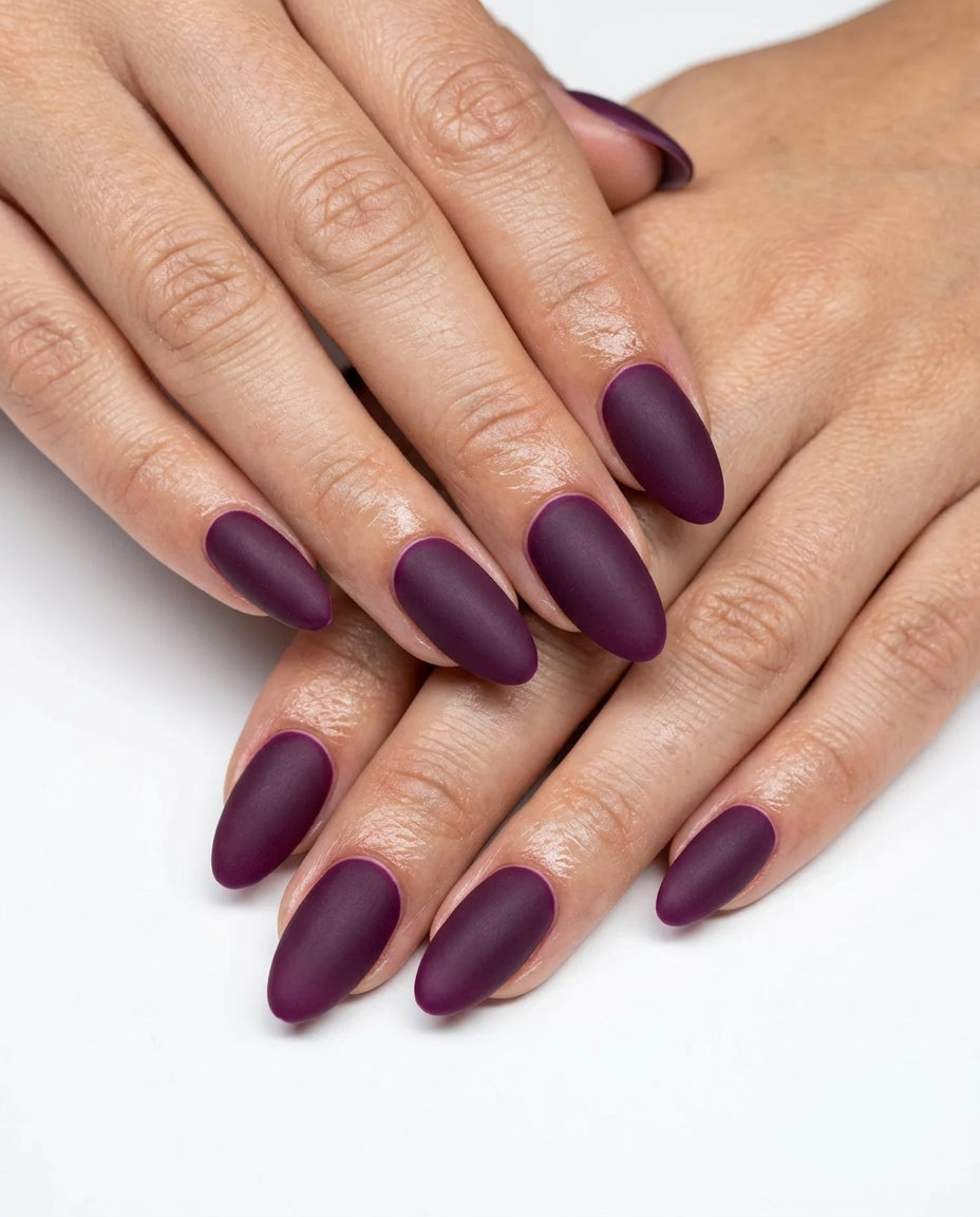 Deep plum oval summer nails 2026 with velvet matte finish for all skin tones.