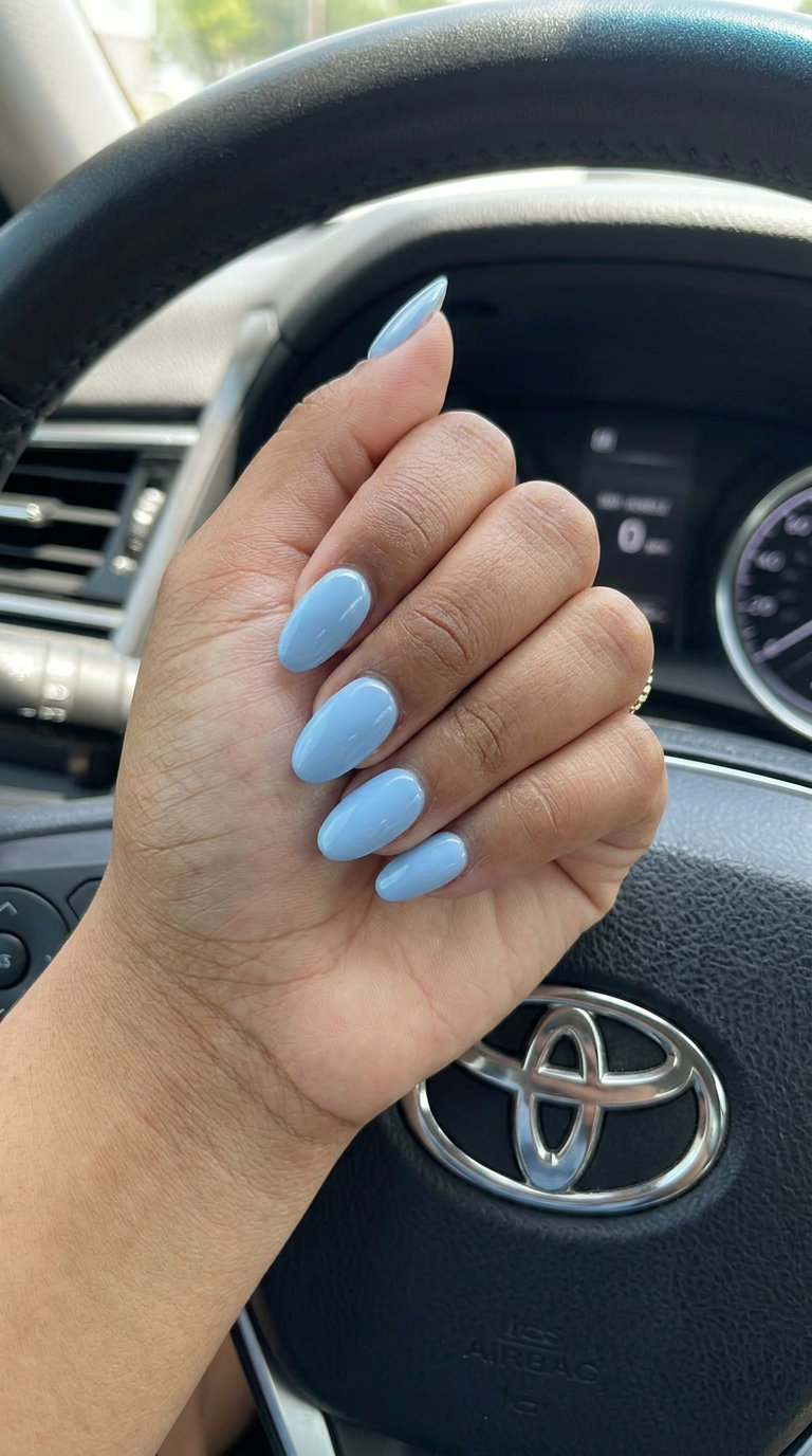 Sky blue oval milky nails: oval summer nails 2026 for all skin tones, serene for daily wear and work.