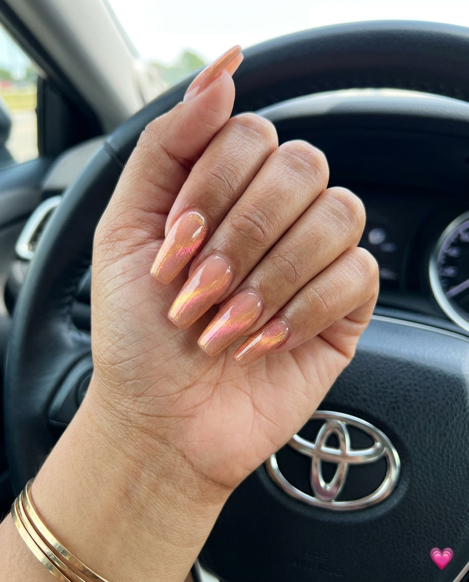 Peachy cat-eye coffin nails with a glossy finish for solid summer nails 2026. Sultry for date night.
