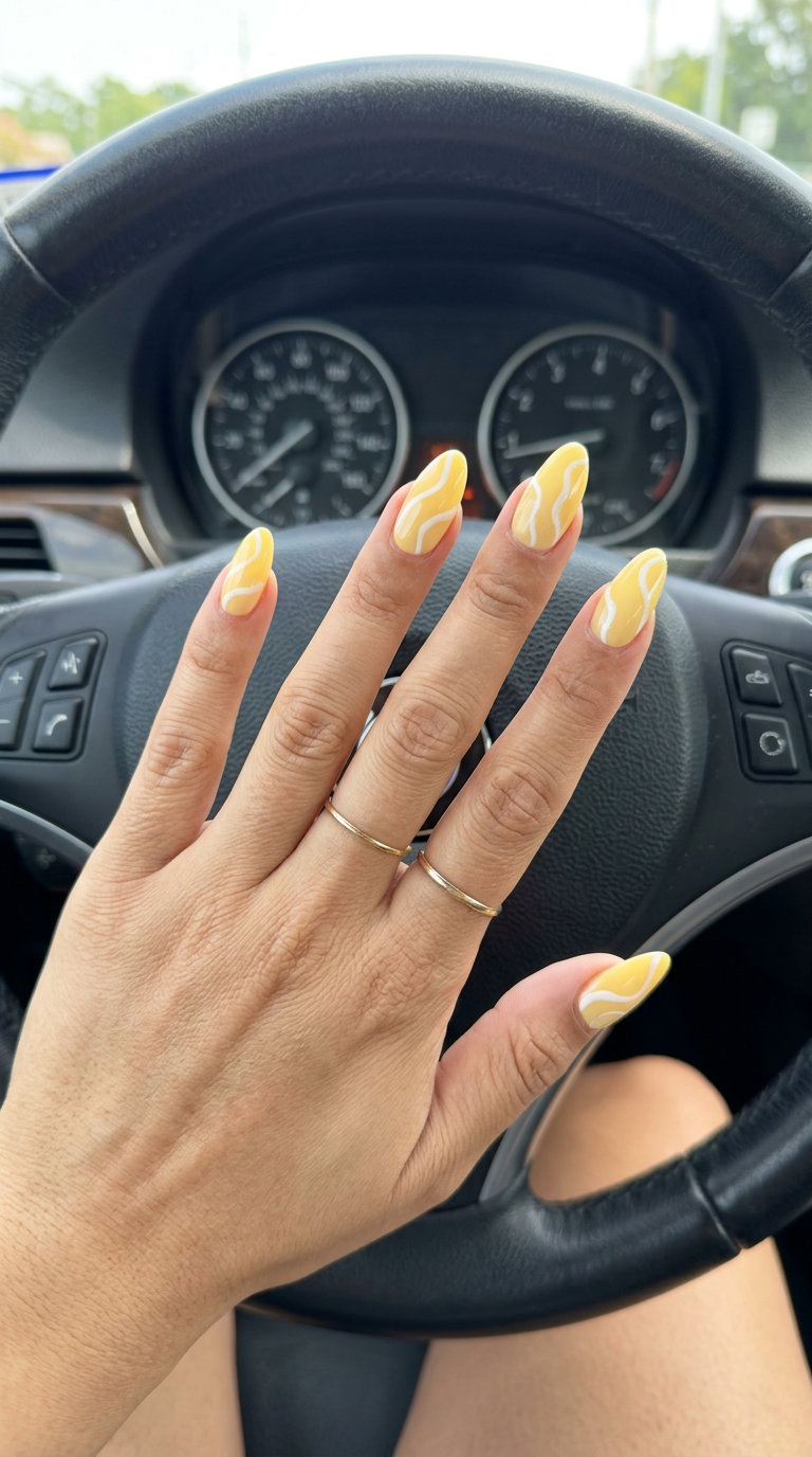 Sunny swirl almond nails, a whimsical solid summer nails 2026 choice for vacations and creative outings.