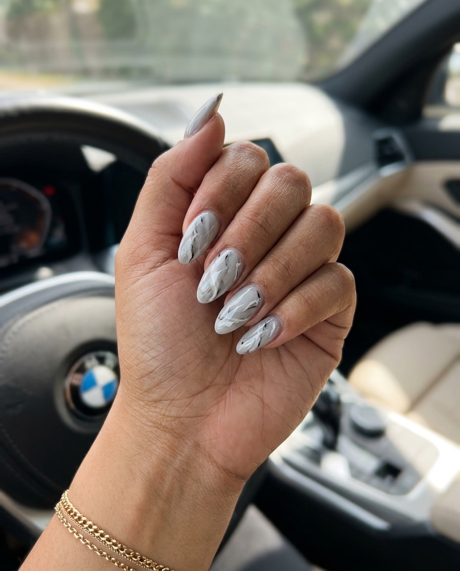 Summer Classy Nails 2026: Marble Almond Elegance Sophisticated summer classy nails 2026: Light grey marble effect on long almond nails for formal events.