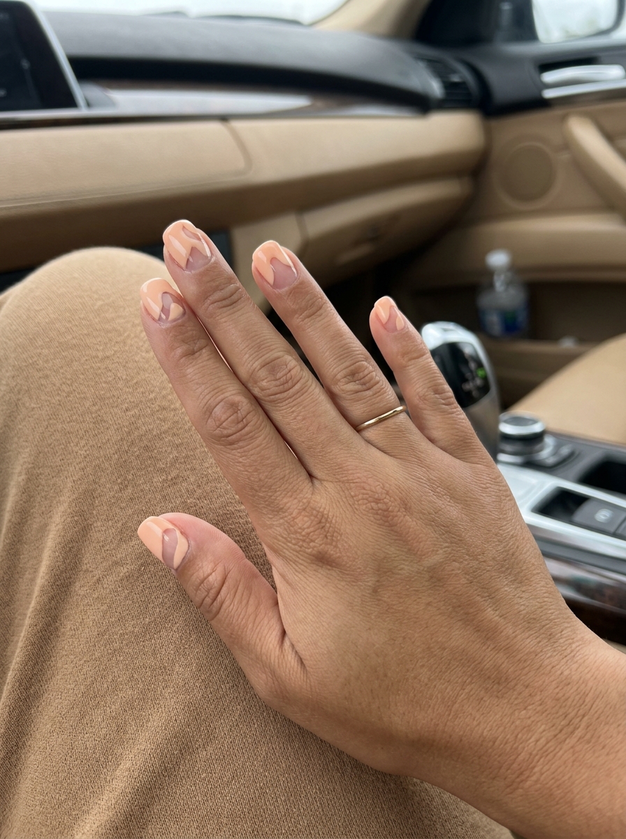 Summer Classy Nails 2026: Peach Negative Space Minimalist summer classy nails 2026: Pale peach geometric cut-outs on short square nails for daily wear.