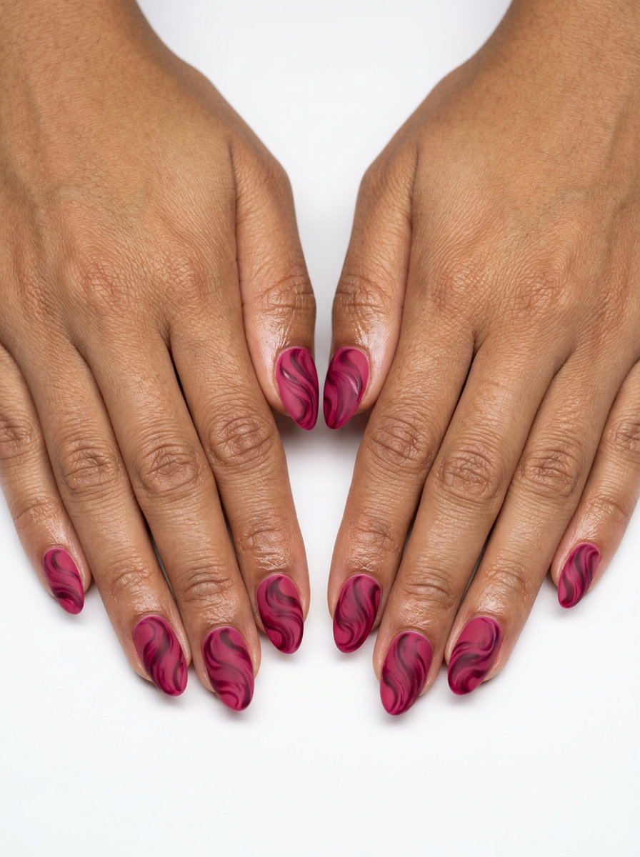 Raspberry swirl matte almond nails for summer fruits nail art 2026. Deep pink, dark berry, velvet.