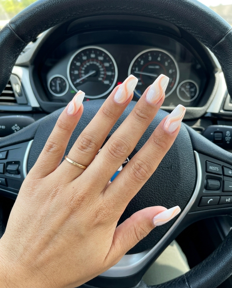 Romantic peach cream swirl nails for summer holiday nails 2026, perfect for weddings and garden parties.