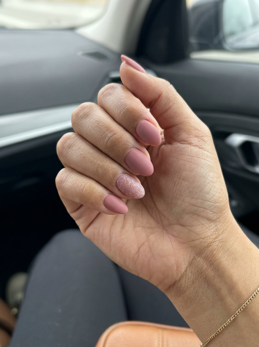Dusty Rose Glitter Accent Nails 2026 | Playful Glam Dusty Rose Matte with Subtle Glitter Accents nails for casual summer days and parties.