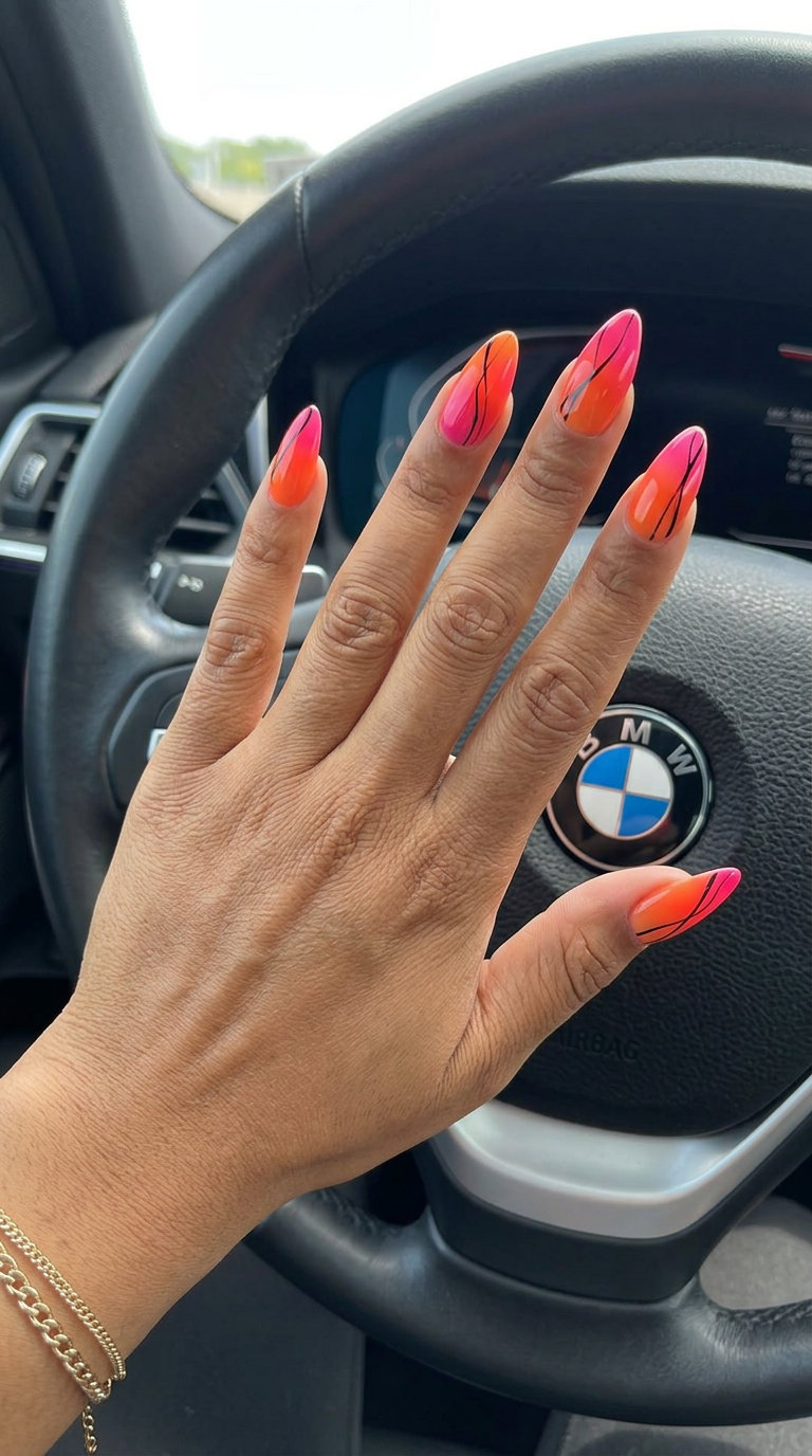 Sunset Ombre Abstract Nails 2026 Fiery Horizon Abstract Ombre nails: bold summer nail art ideas 2026 with sunset orange, pink, and black lines.