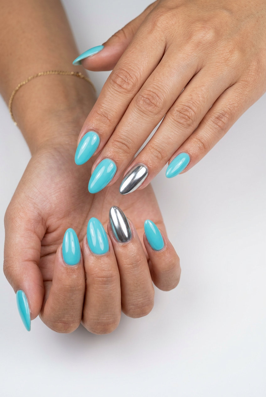 Aqua Blue Metallic Accent: Futuristic party nails with vibrant aqua blue & mirror silver accent. Summer nails colors 2026.