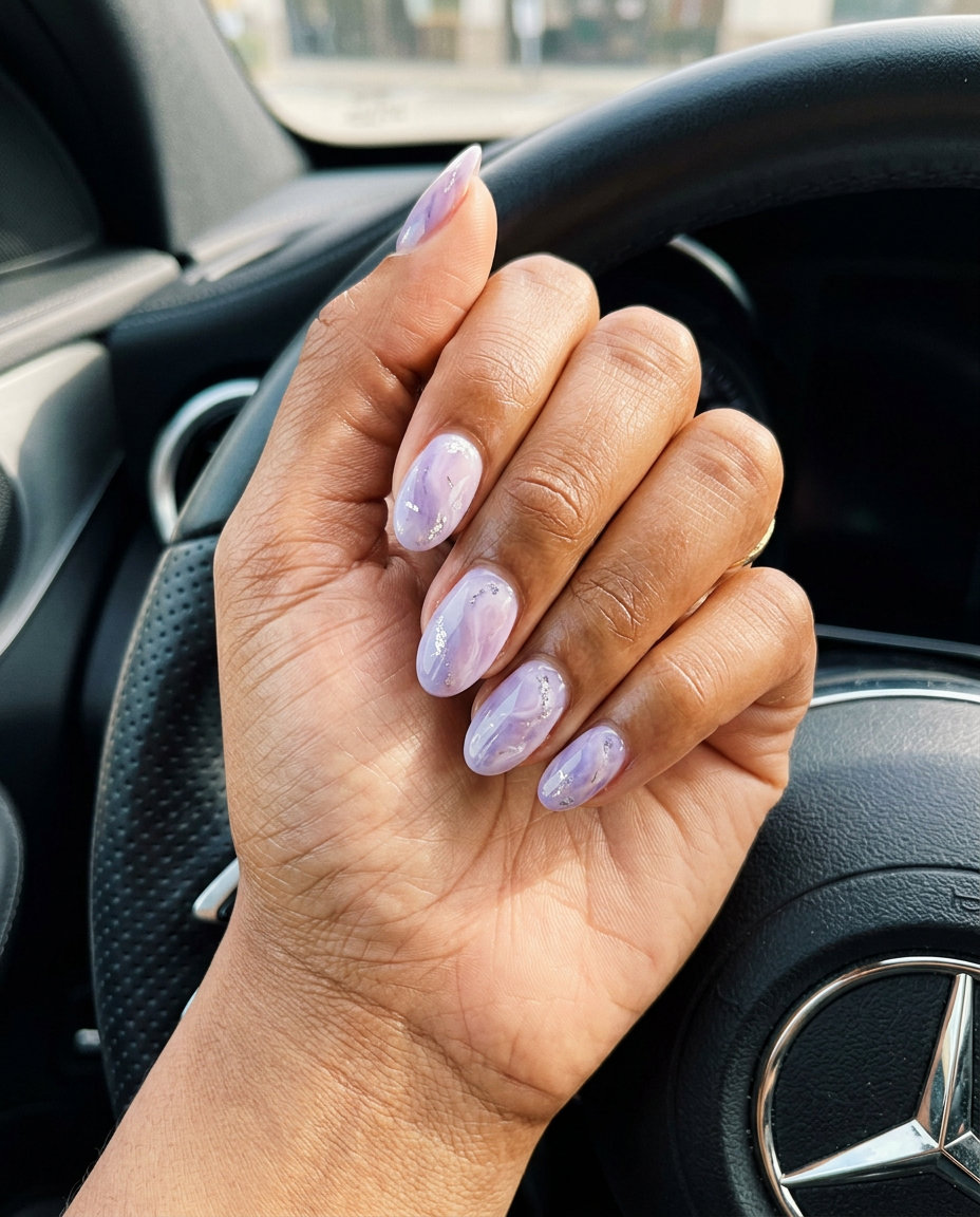 Lavender Marble Nails 2026: Wedding Guest Glam Dreamy lavender marble nails with silver accents for summer 2026 weddings and events. Romantic and ethereal.