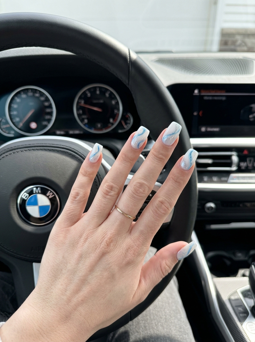 Icy Blue Milky Swirls Nails 2026 | Dreamy Summer Vacation Style Icy Blue Milky Swirls on Medium Length nails for summer 2026, dreamy for vacations.
