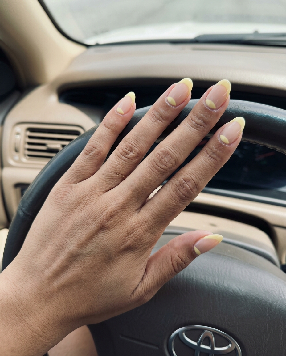 Pastel yellow reverse French oval nails for summer 2026. Elegant and minimalist work or bridal shower style.