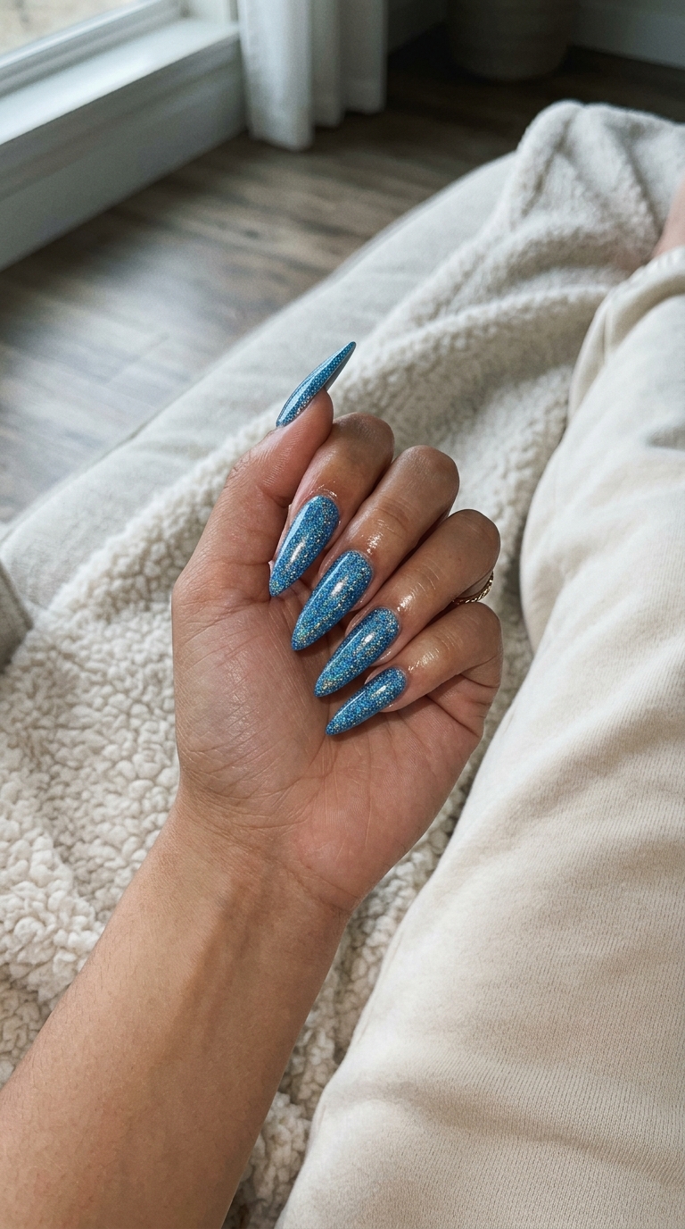 Holographic blue glitter stiletto nails for summer vibes nails 2026, perfect for festivals.