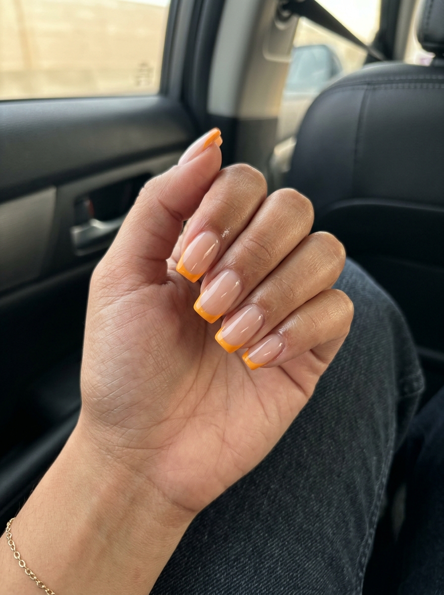 Mango Orange Reverse French Tip 2026 Mango orange reverse French tip nails, a playful twist on tropical nail designs 2026.