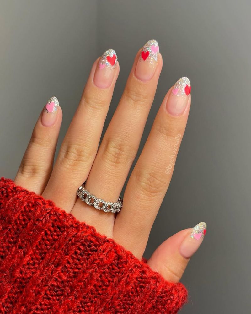 Medium Almond Glitter French With Heart Accents Medium Almond Glitter French With Heart Accents — Heart Nails