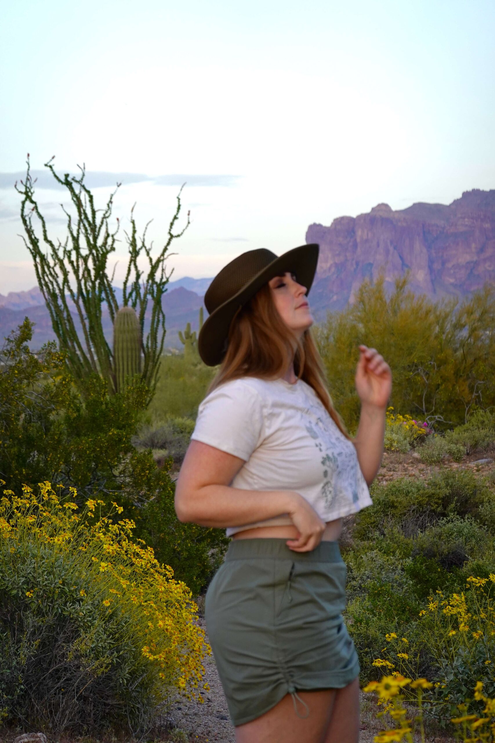 White Graphic Tee and Olive Green Shorts for Warm Hikes — Hiking Outfits