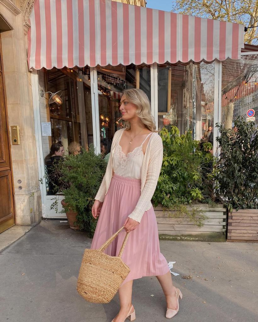 Pink Pleated Midi Skirt with Cream Knit Cardigan and Straw Tote — Tea Party Outfits