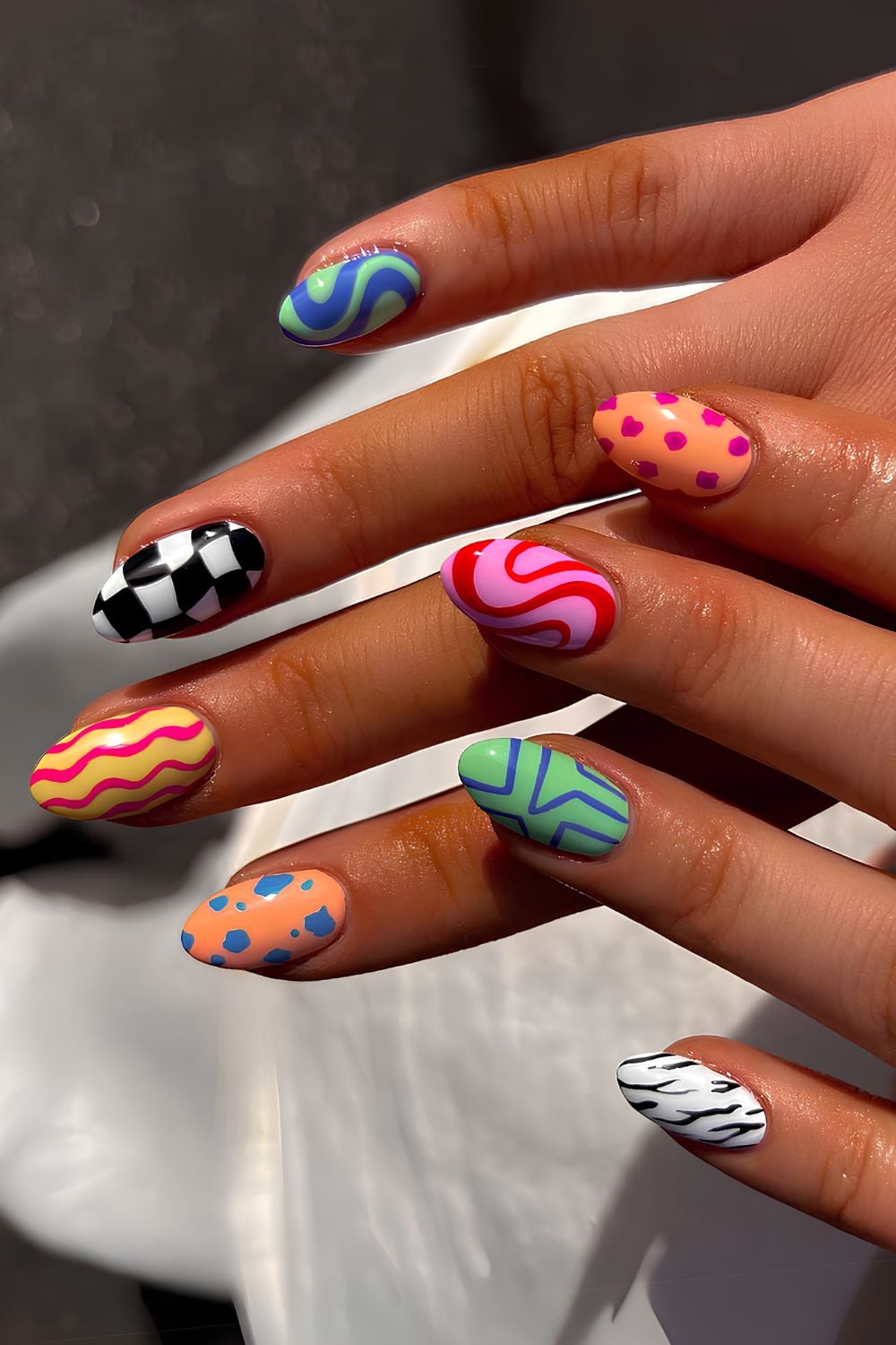 Vibrant Graphic Mix on Oval Nails — Mismatched Nails