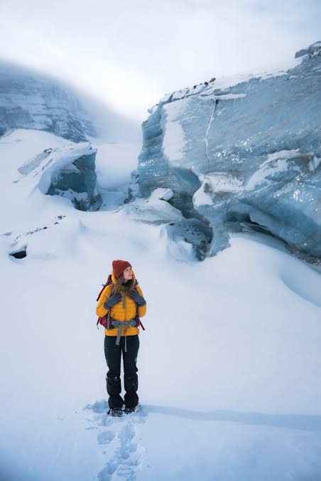 Yellow Puffer Jacket and Black Pants for Snowy Trails — Hiking Outfits