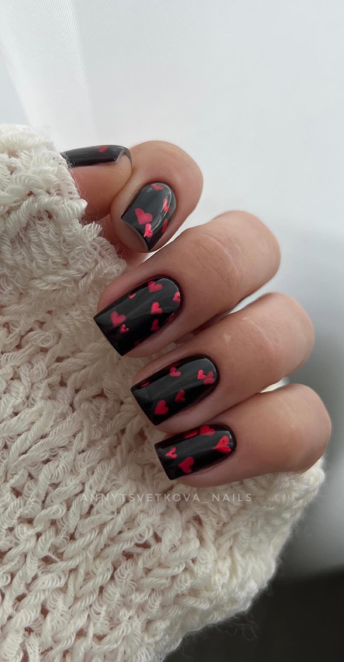 Chic Black Valentine Nails with Red Heart Confetti
