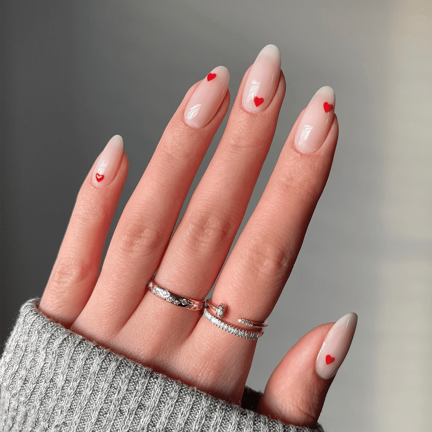 Sheer Nude Almonds with Red Heart Accents — Minimalist Nails