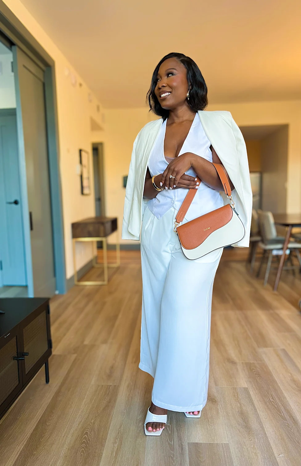 Relaxed Beige Trench Coat Over Knit Top and Jeans — Midsize Outfits