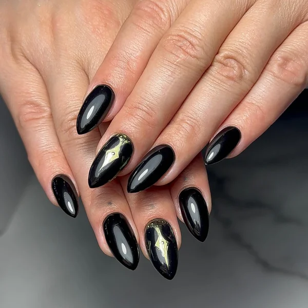 Medium Almond with Glossy Black and Subtle Gold Accents — Black and Gold Nails