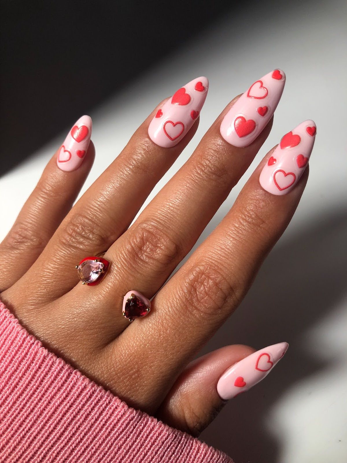 Long Stiletto Pink With Scattered Red Hearts Long Stiletto Pink With Scattered Red Hearts — Heart Nails
