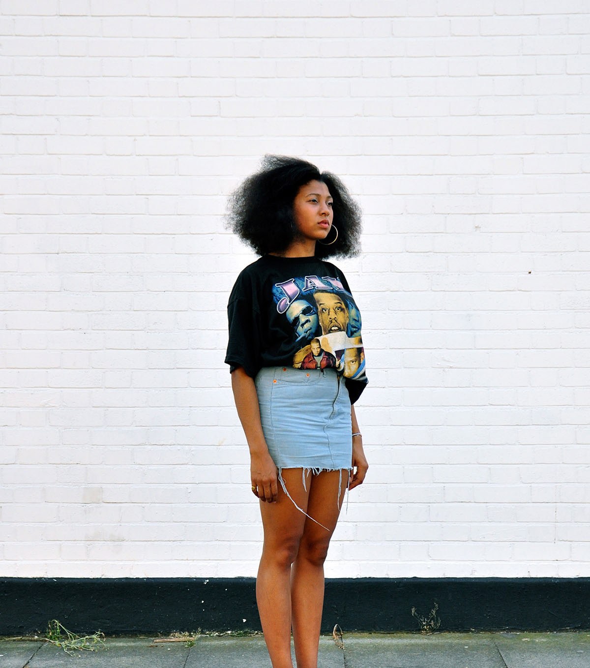 Oversized Graphic Tee Paired with a Denim Mini Skirt for Retro Vibes Oversized Graphic Tee Paired with a Denim Mini Skirt for Retro Vibes — Rockstar Girlfriend Outfits