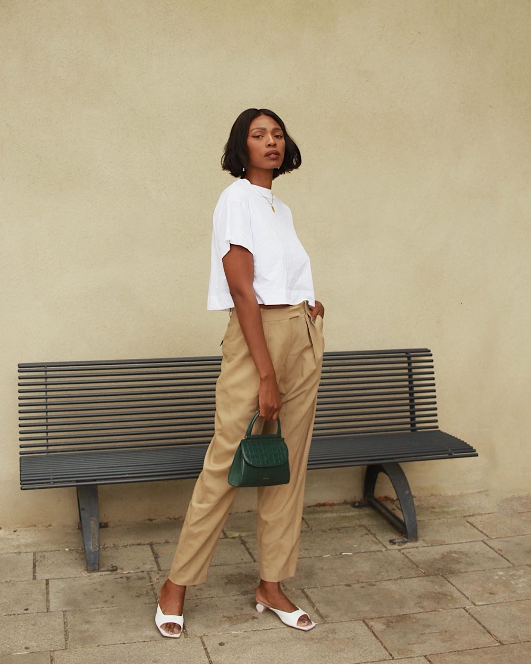 White Cropped Top and Beige Wide-Leg Trousers with Green Bag — Minimalist Outfits