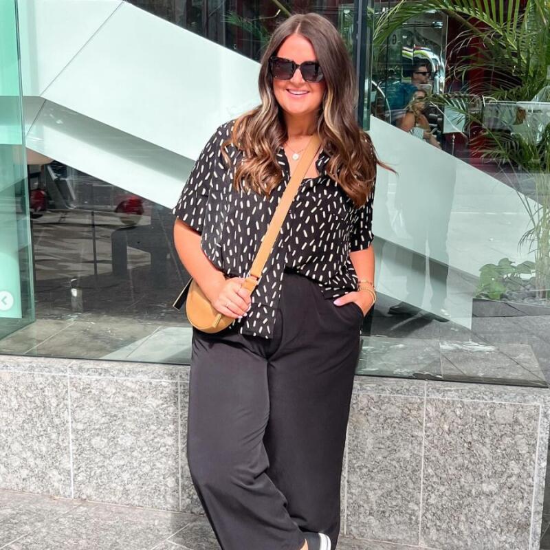 Patterned Blouse with Black Wide-Leg Trousers and Sneakers — Midsize Outfits