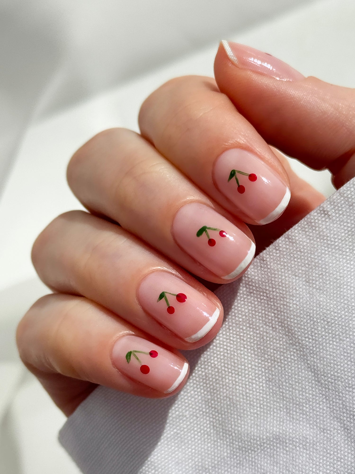 Short Natural White French Tips With Cherries Short Natural White French Tips With Cherries — Cherry Nails