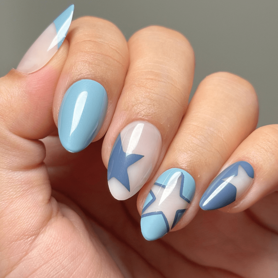 Light Blue Stars on Sheer Nude Light Blue Stars on Sheer Nude — Short Almond Nails