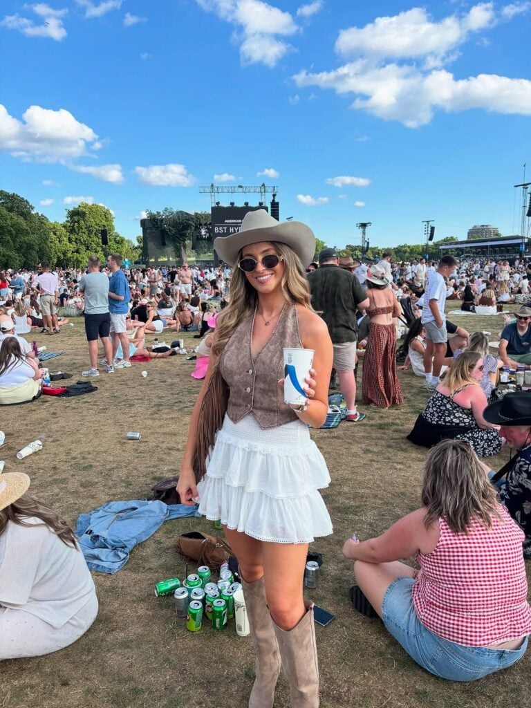 Suede Vest Over Tiered Mini Skirt with Tan Cowboy Boots Suede Vest Over Tiered Mini Skirt with Tan Cowboy Boots — Country Concert Outfits