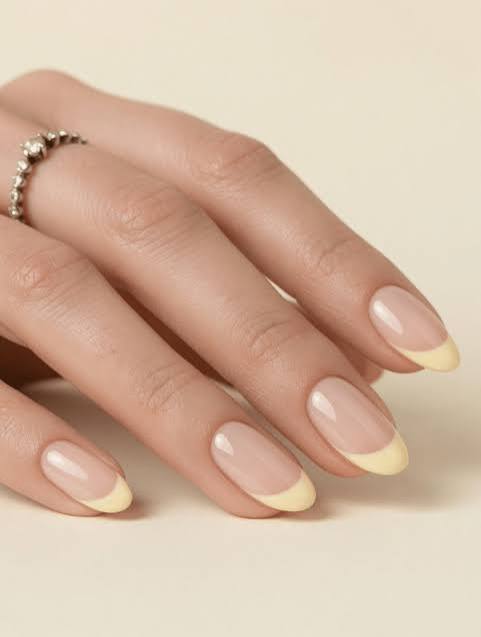 Soft Yellow French Tips on Sheer Pink — Medium Nails