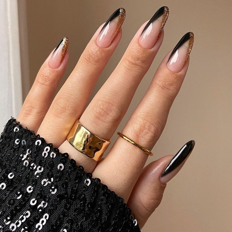 Glossy Glitter Sheer Nude with Glitter Gold and Black French Tips — Black and Gold Nails