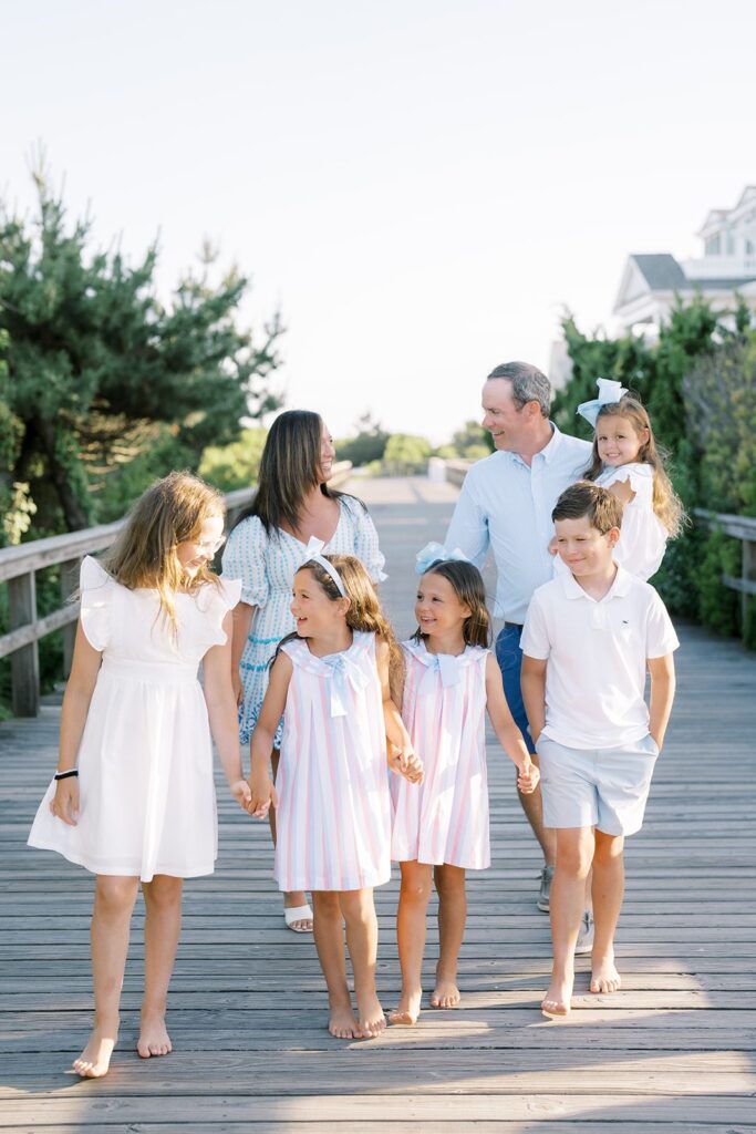 Boardwalk Breeze: Pastel Striped Dresses and Light Blue Collared Shirts Boardwalk Breeze: Pastel Striped Dresses and Light Blue Collared Shirts — Family Photo Outfits
