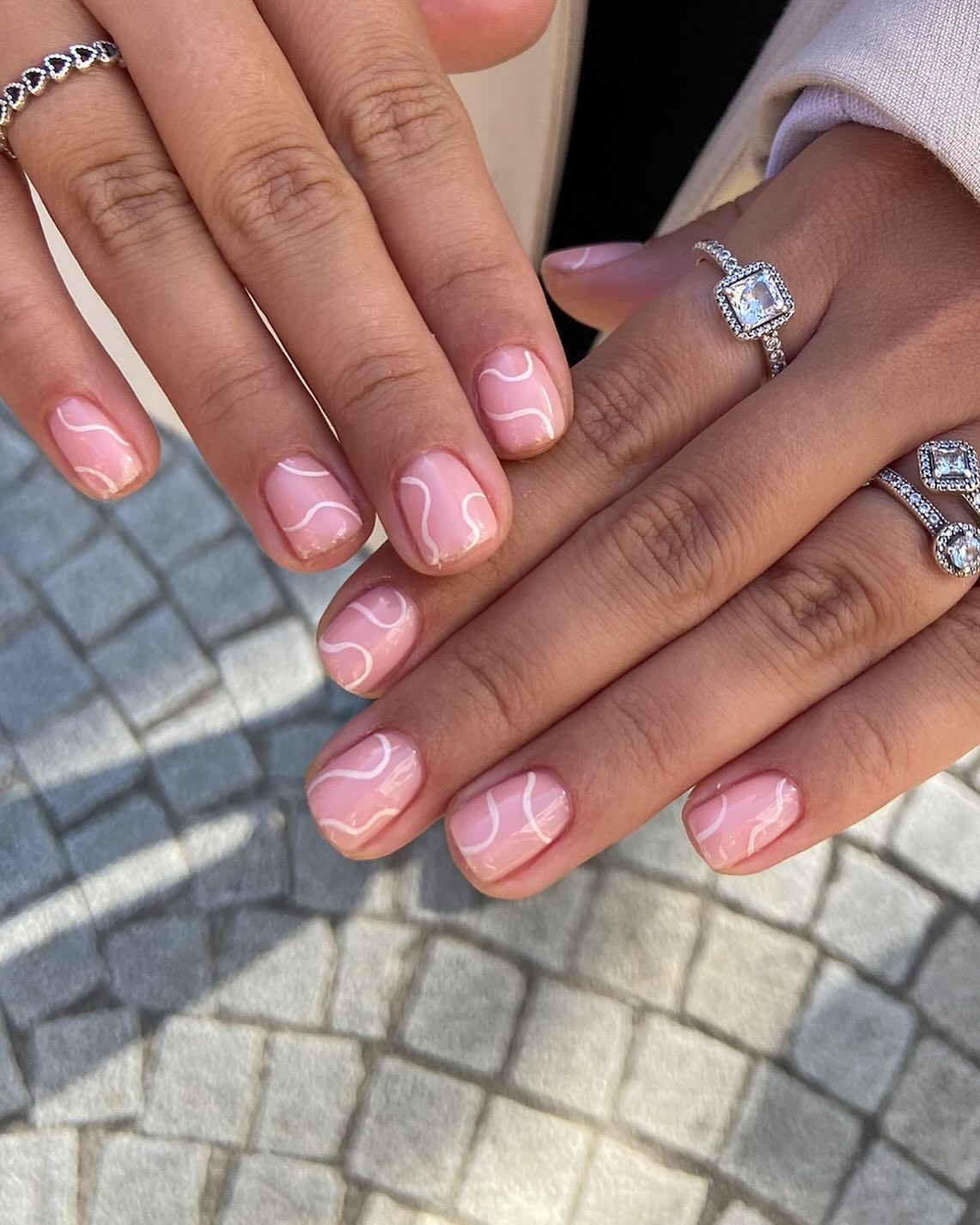 Pale Pink With White Wavy Lines — Very Short Nails