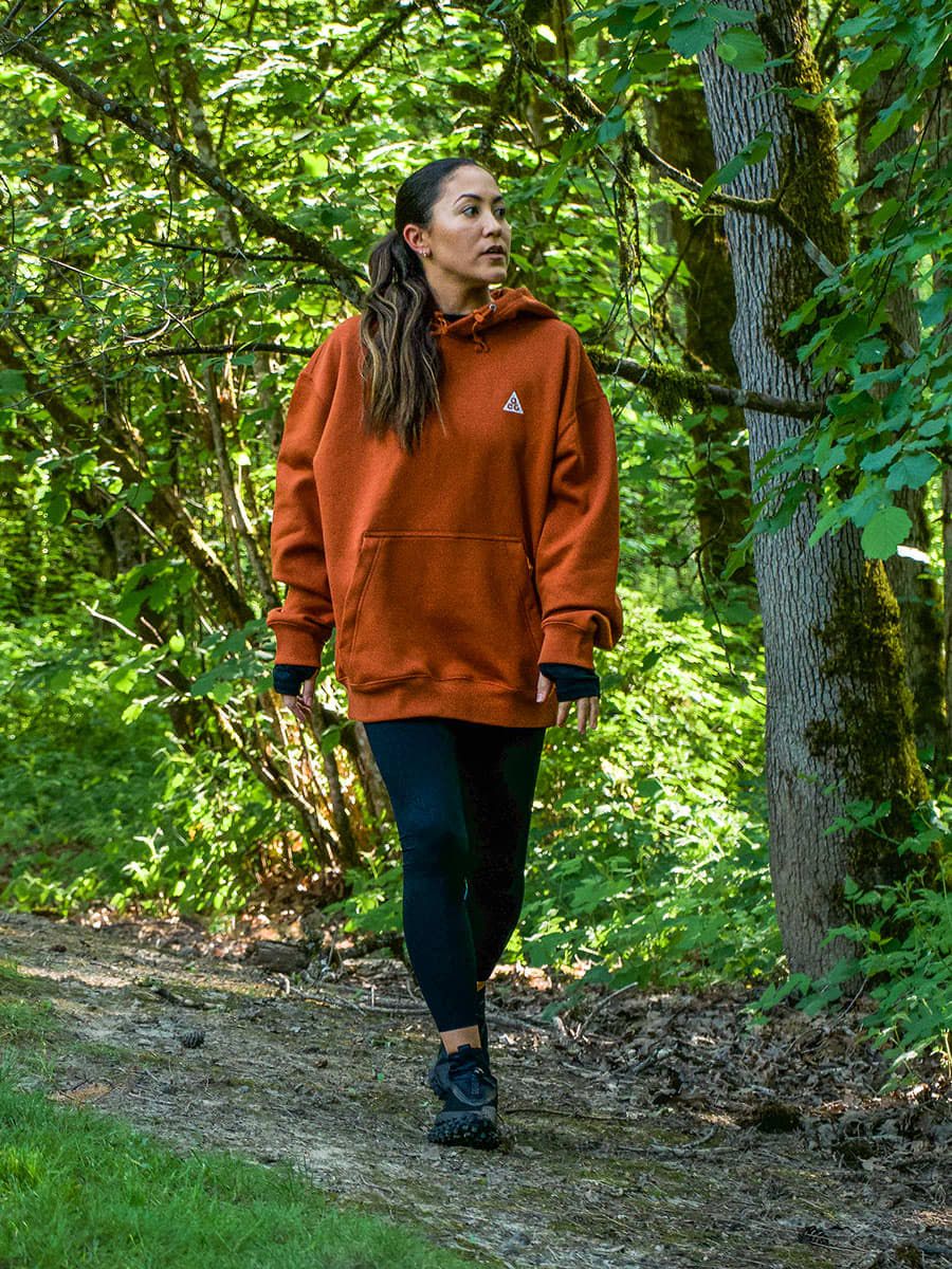 Oversized Orange Fleece Hoodie Over Black Leggings — Hiking Outfits