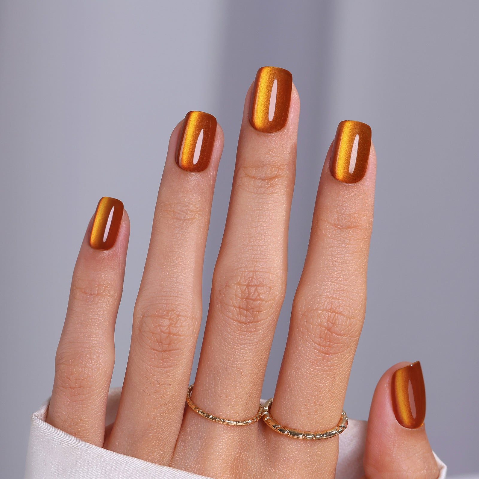 Glossy Metallic Cat Eye Visual Idea — Orange Nails