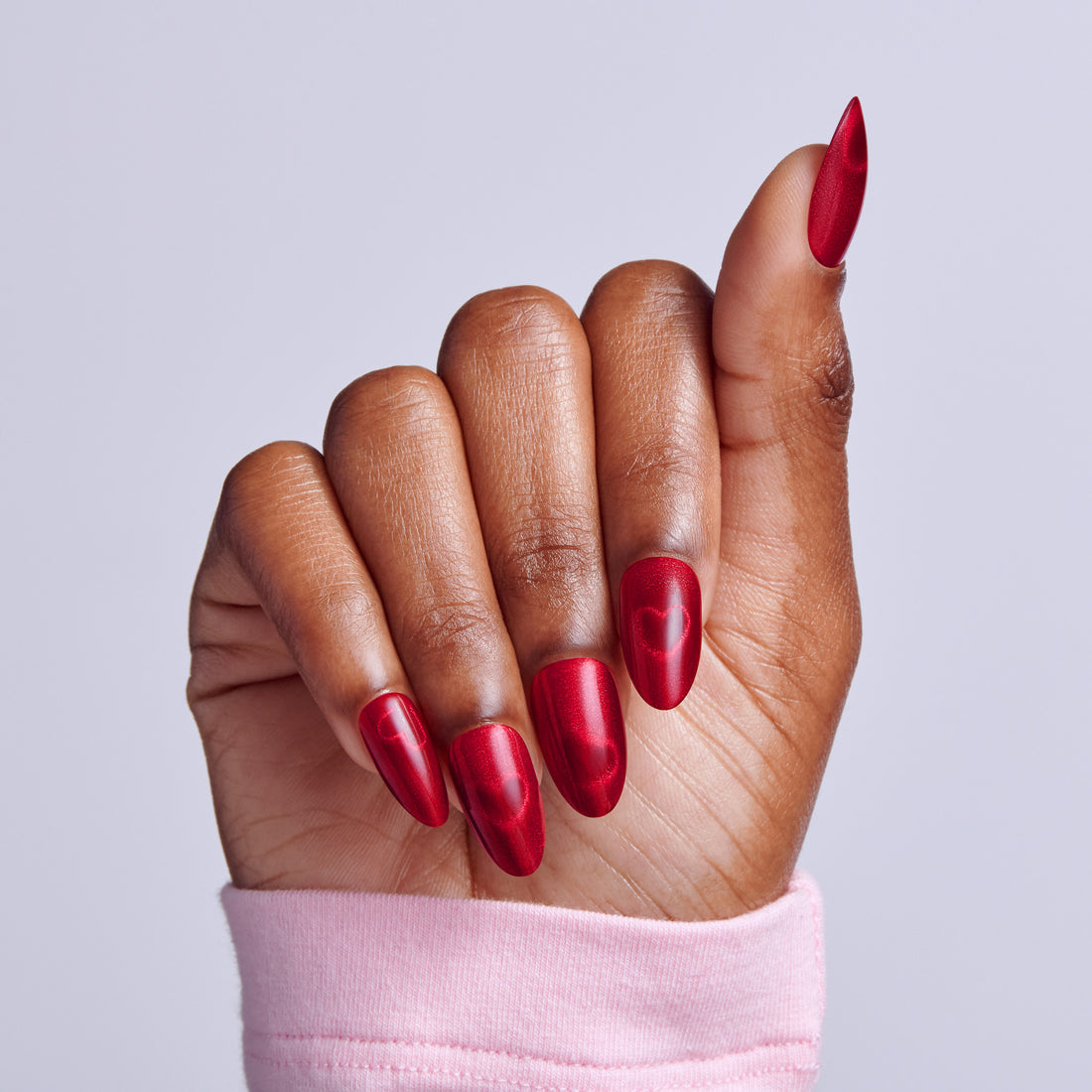 Metallic Red Almonds with Embossed Hearts Metallic Red Almonds with Embossed Hearts — Date Night Nails