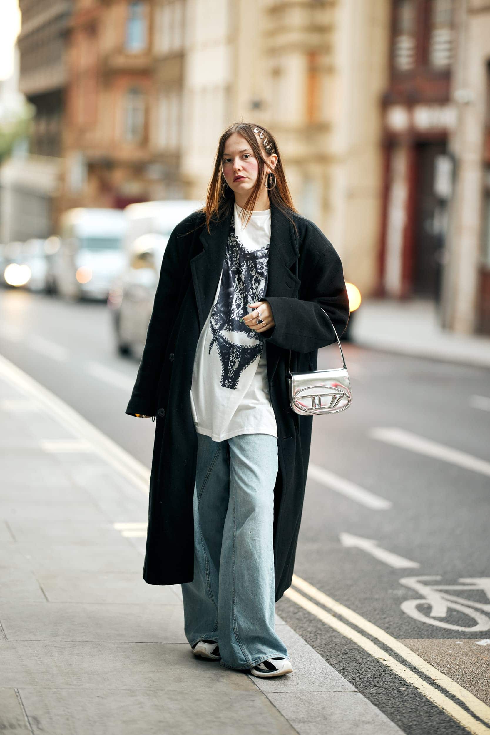 Long Black Coat with Graphic Tee and Wide-Leg Jeans for Relaxed Style Long Black Coat with Graphic Tee and Wide-Leg Jeans for Relaxed Style — London Outfits