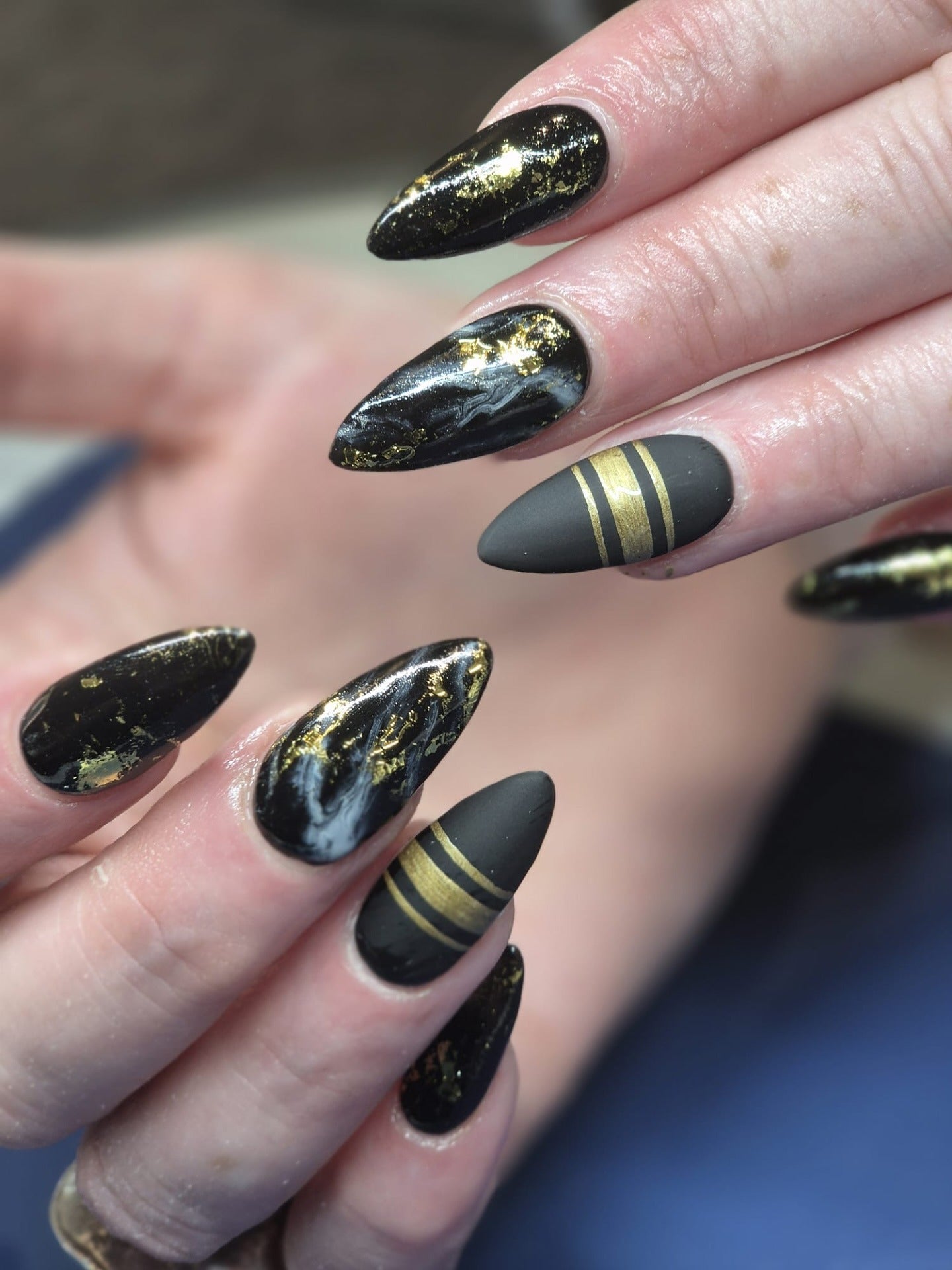 Medium Stiletto Mix Glossy Marble with Foil and Matte Stripes — Black and Gold Nails